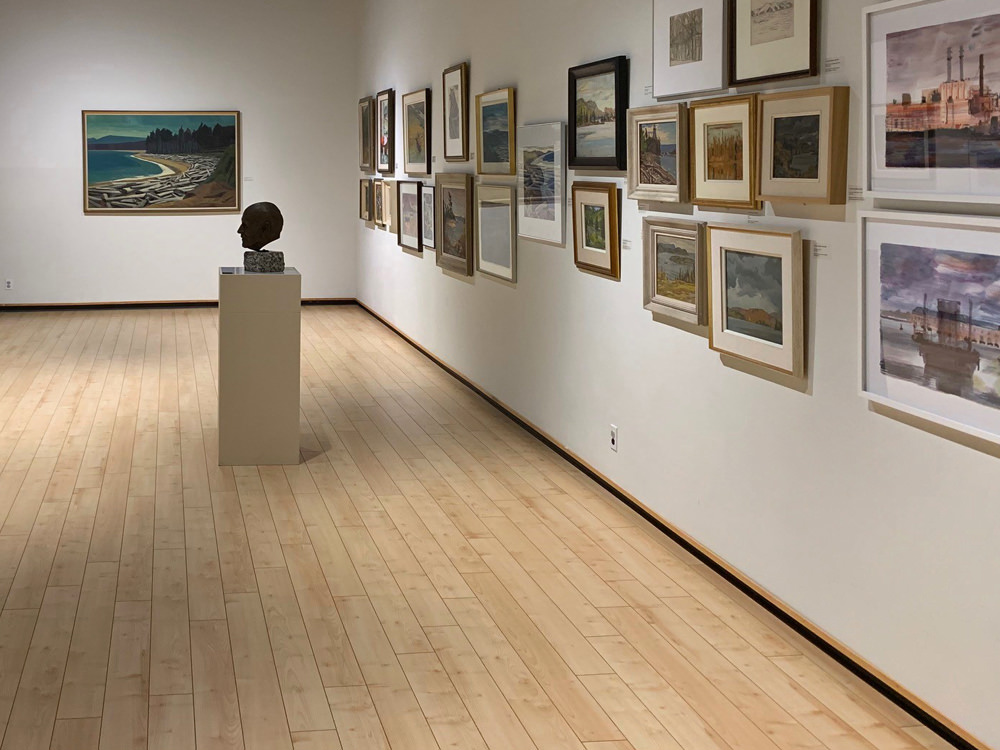 A viewing wall of art at the Algoma Art Gallery