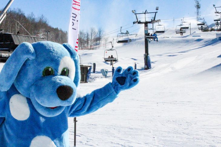 Daggy the Dog poses in front of Dagmar Ski Resort