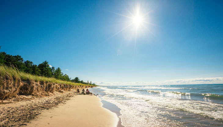 A sunny, sandy beach along Ontario's Lake Huron shoreline.