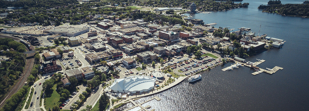 Aerial view of Kenora, the Whitecap Pavillion and docks at the harbourfront