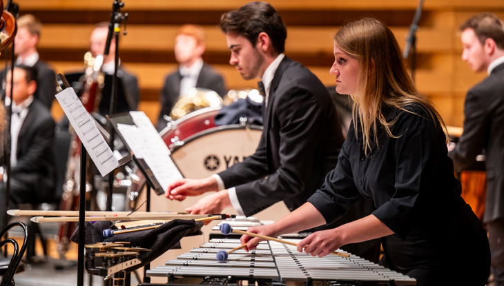 Musicians playing instruments.