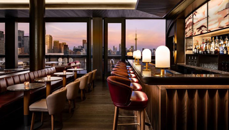 An empty bar that showcases city views