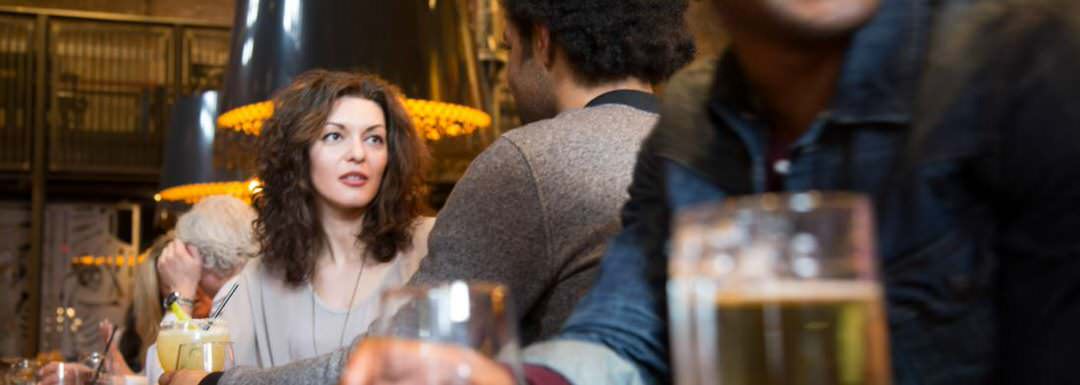 Woman having dinner with a man in a restaurant.