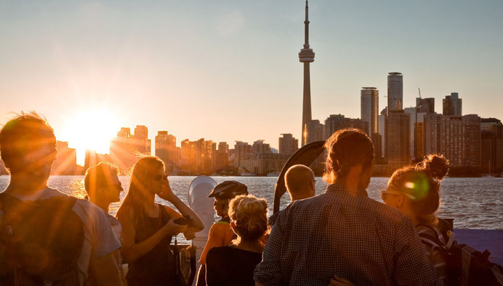 A group of people on the ferry back to the harbour from Toronto Islands.