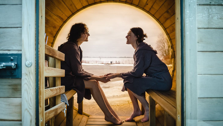 Two women relaxing in a sauna