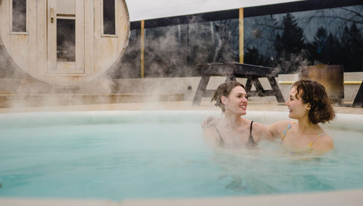 A couple enjoy a swim after a sauna in Prince Edward County.